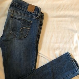 Black and Medium wash skinny American eagle jeans